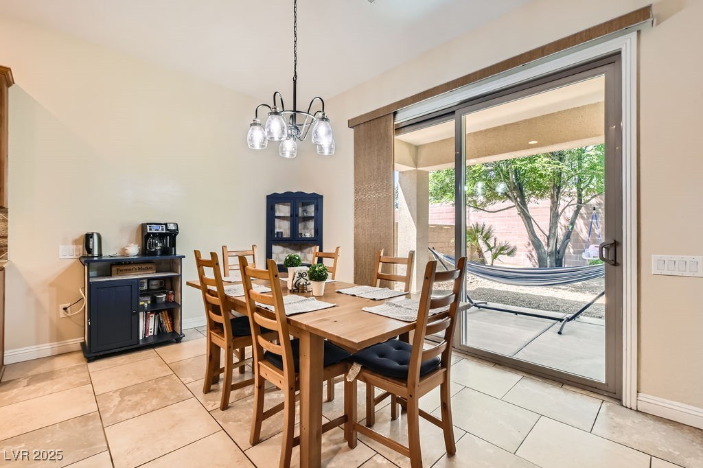 7513 Java Sparrow Street North Las Vegas, NV 89084 - Photo 8 of 36 Dining area featuring a chandelier and access to b
