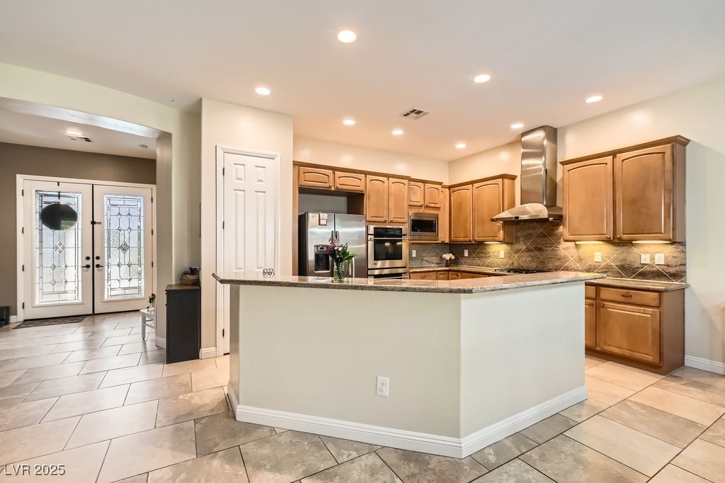 7513 Java Sparrow Street North Las Vegas, NV 89084 - Photo 10 of 36 Kitchen with a center island, granite countertops,