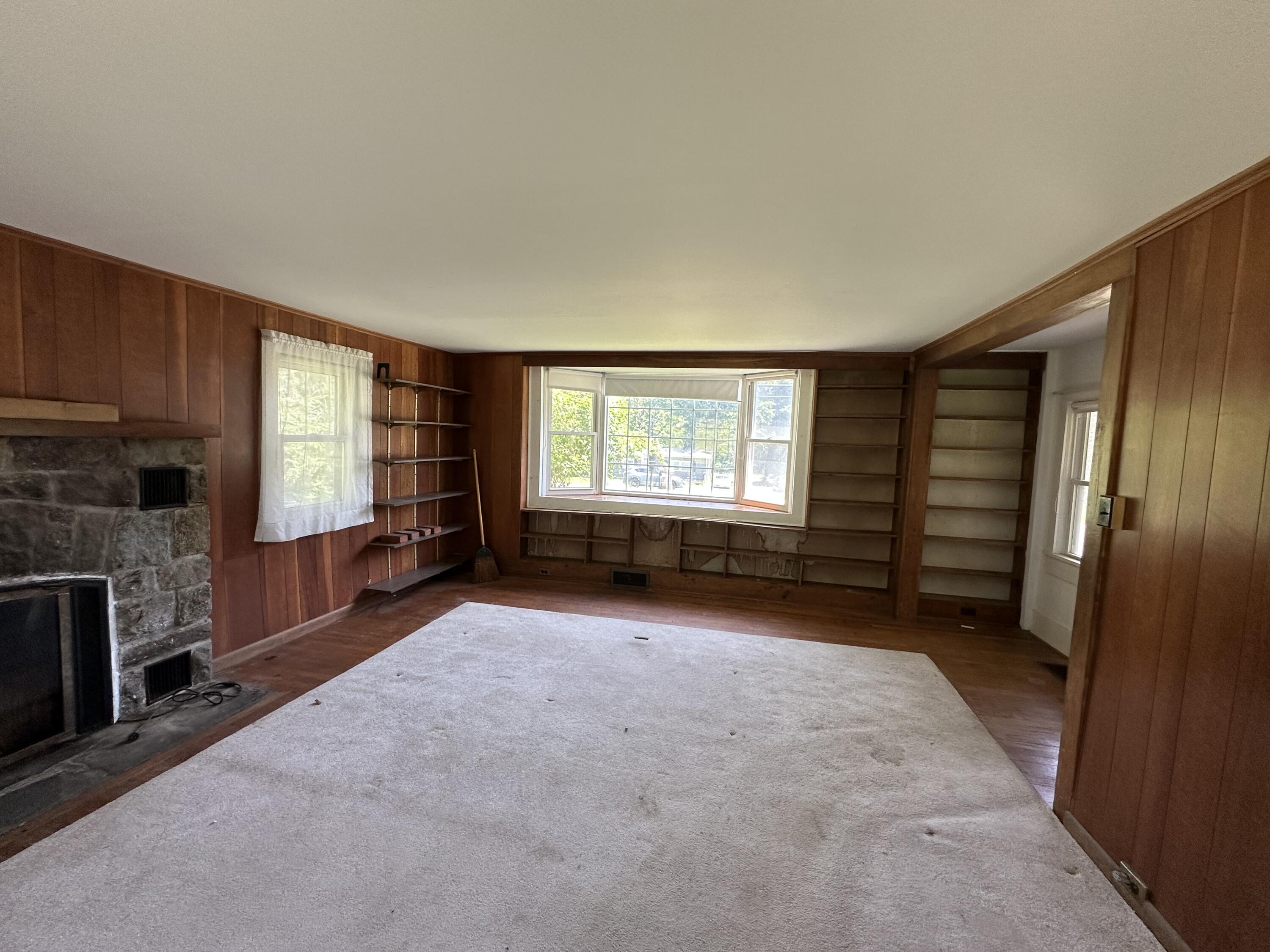 337 Summit Road Swiftwater, PA 18370 - Photo 19 of 35 an empty room with fireplace and windows