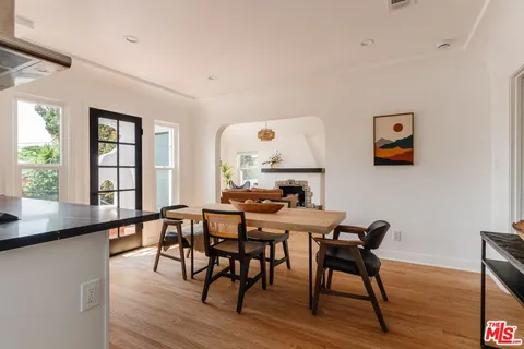 a view of a kitchen with a table and chairs