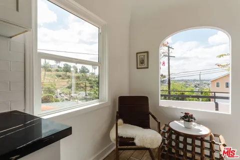 a bed room with a bed and a chair