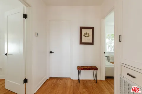 a bathroom with a double vanity sink mirror and shower