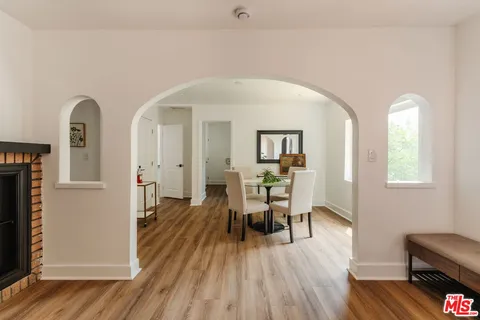 a bedroom with a bed and a mirror