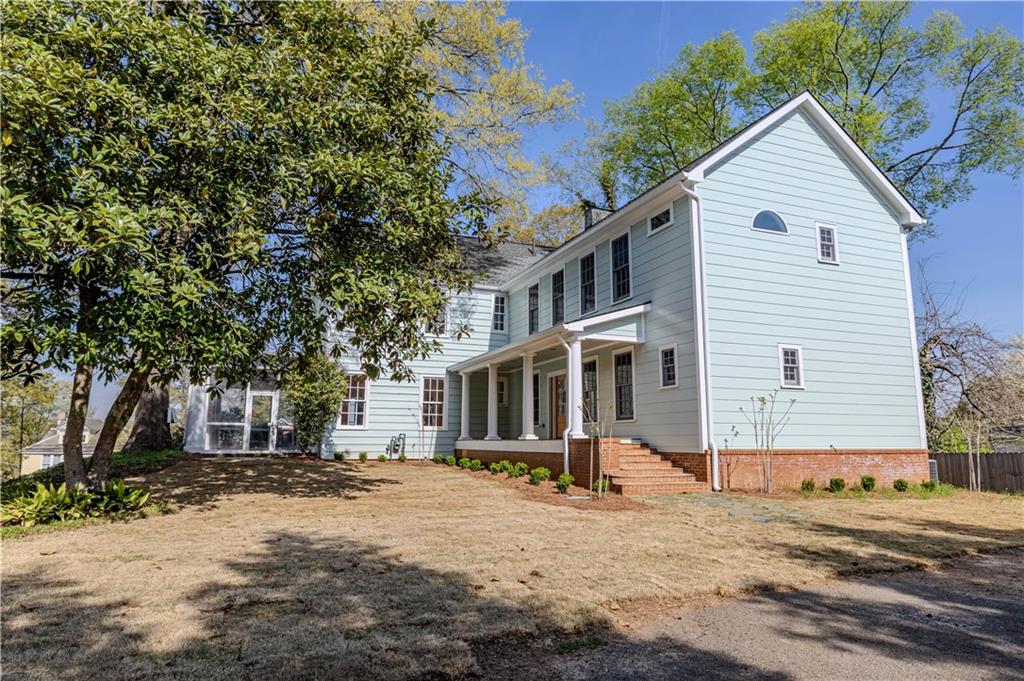 312 East 3rd Street Rome, GA 30161 - Photo 3 of 42 a front view of a house with a yard