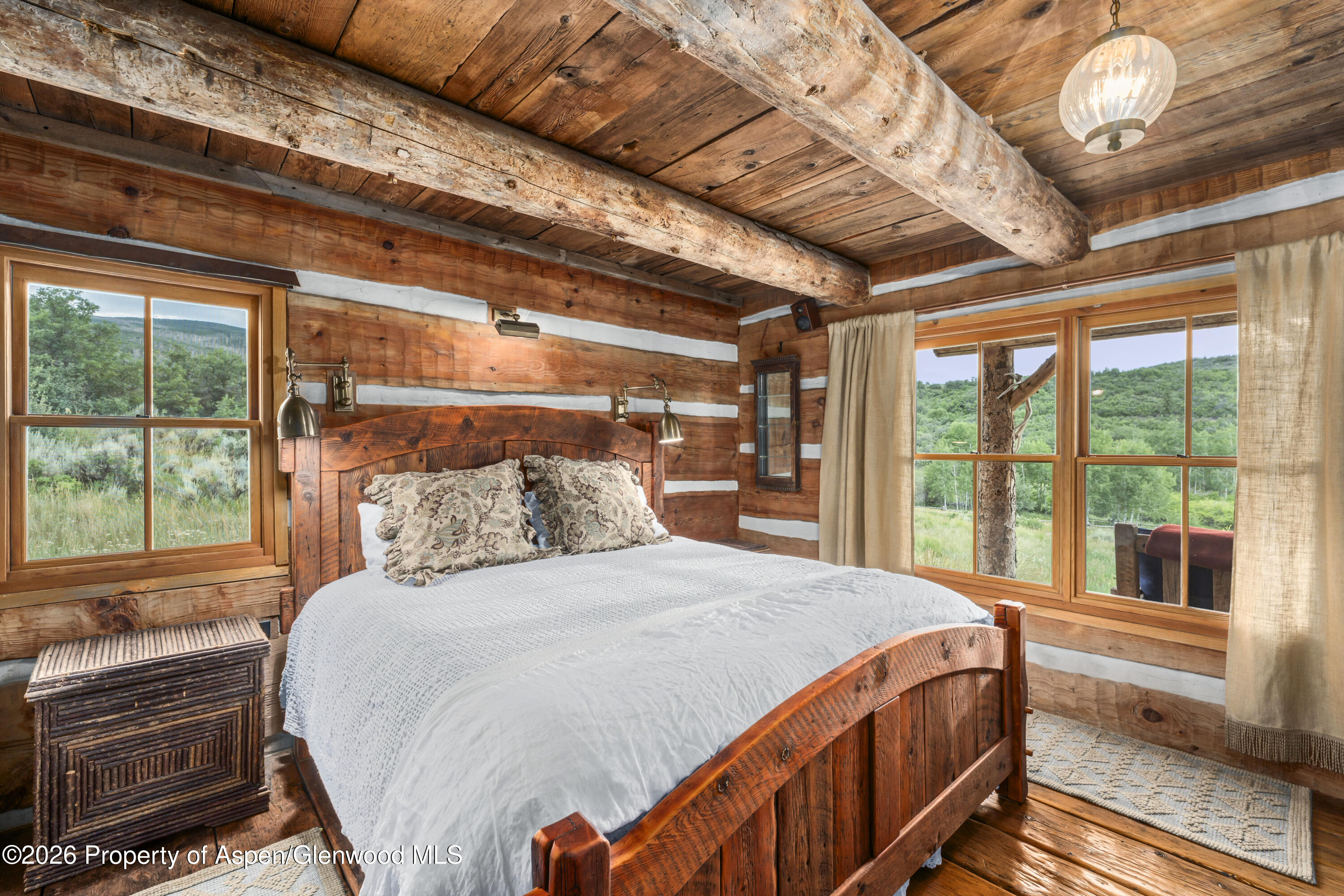 1350 Old Herron Road Basalt, CO 81621 - Photo 22 of 81 a bedroom with a large bed and a large window with outer view