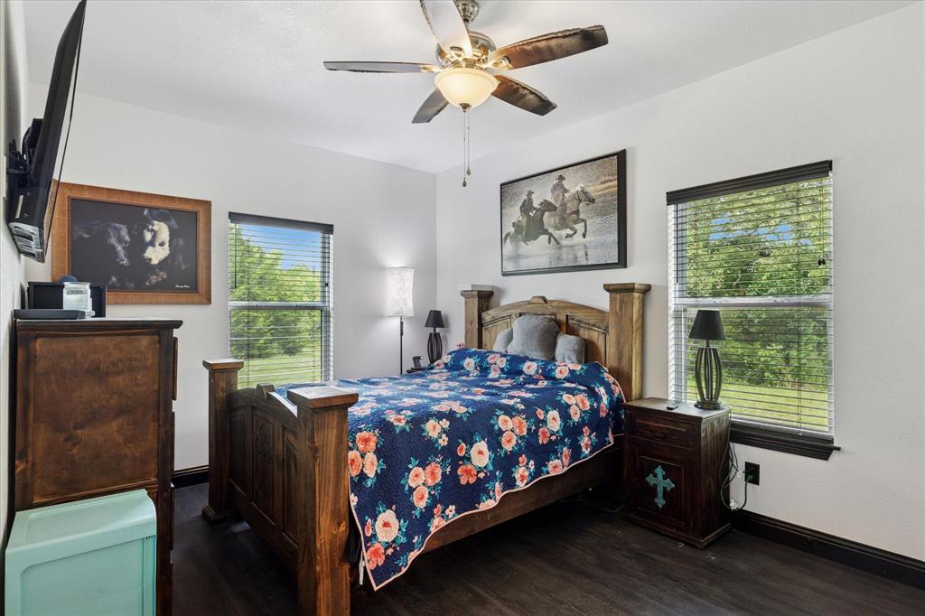 403 Polk Road Bowie, TX 76230 - Photo 19 of 36 a bedroom with a bed and a window