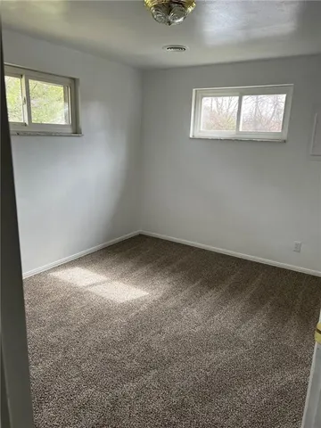 an empty room that has a window