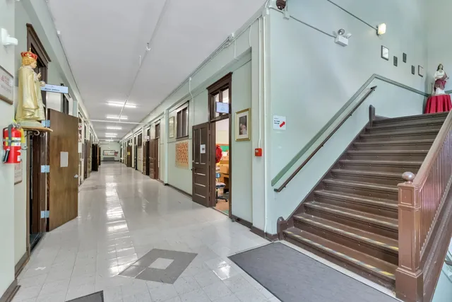 a view of a hallway with a living room