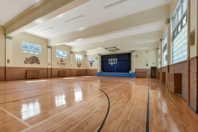 a view of room with window and wooden floor