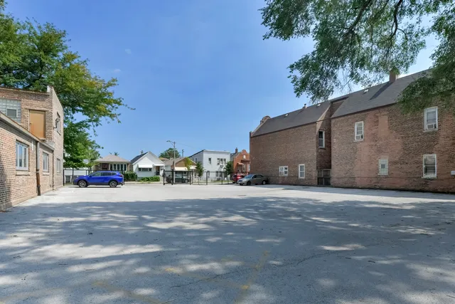 a view of a house with a yard and garage