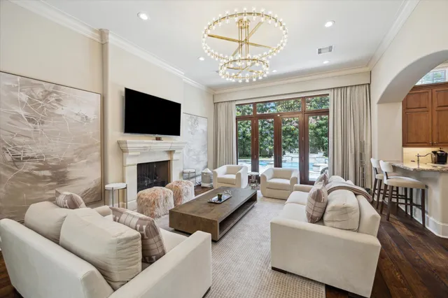a living room with furniture fireplace and a flat screen tv