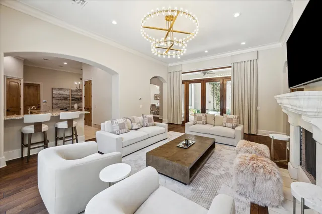 a living room with fireplace furniture and a flat screen tv