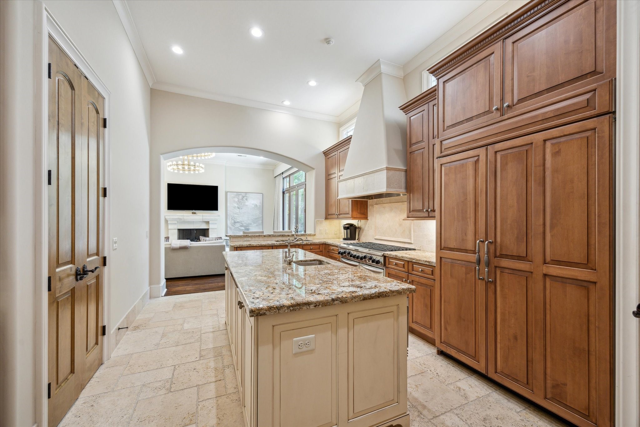 1110 Longmont Pl Court Houston, TX 77056 - Photo 15 of 35 a kitchen with kitchen island granite countertop wooden cabinets and white appliances