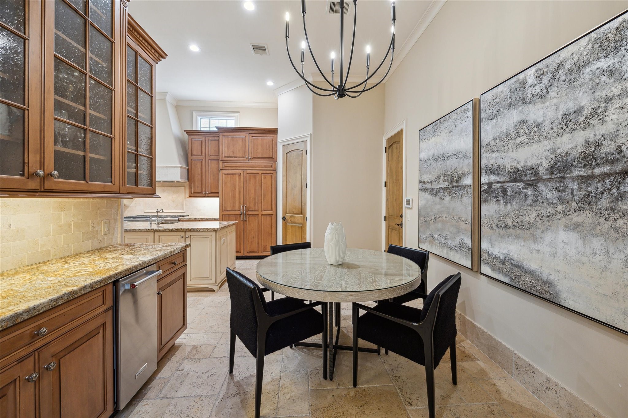 1110 Longmont Pl Court Houston, TX 77056 - Photo 16 of 35 a kitchen with stainless steel appliances granite countertop a sink a stove a table and chairs