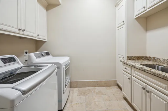a living room with furniture a flat screen tv and a large window