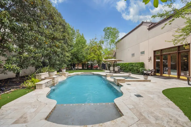 a view of a backyard with a patio