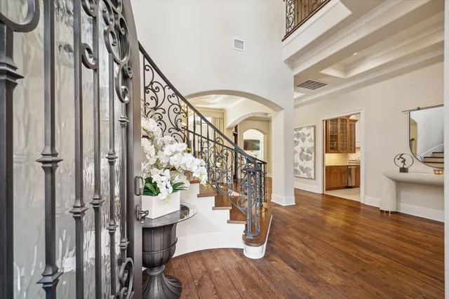a view of an entryway with wooden floor and windows