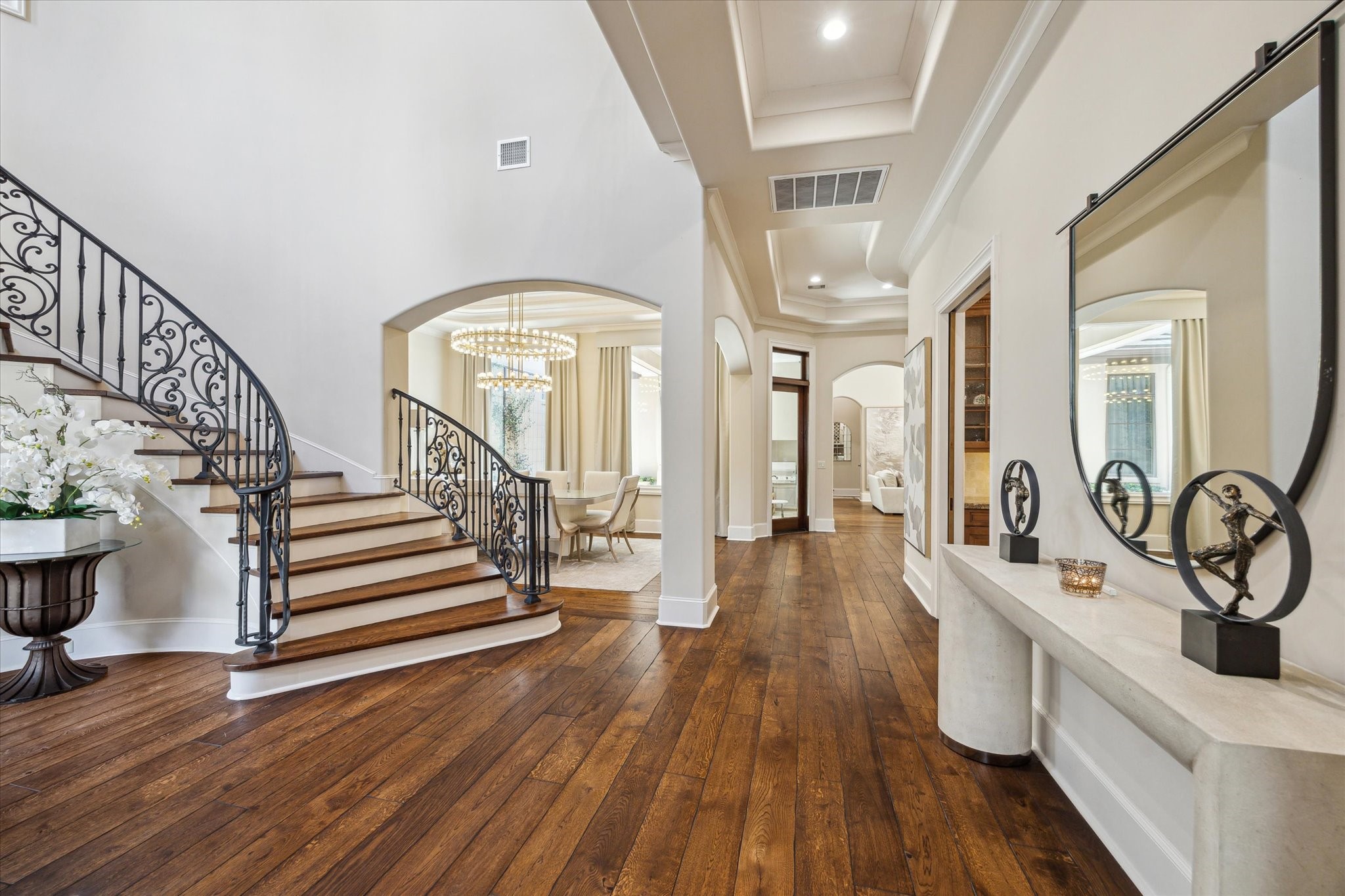1110 Longmont Pl Court Houston, TX 77056 - Photo 7 of 35 a view of a hallway with wooden floor and staircase