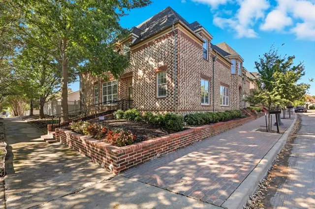 a view of a street with houses on both side