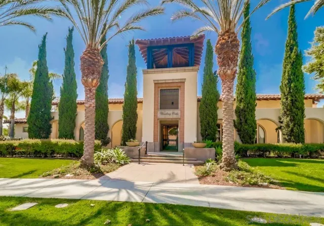 a front view of a house with plants