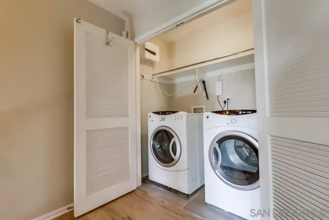 a utility room with dryer and washer