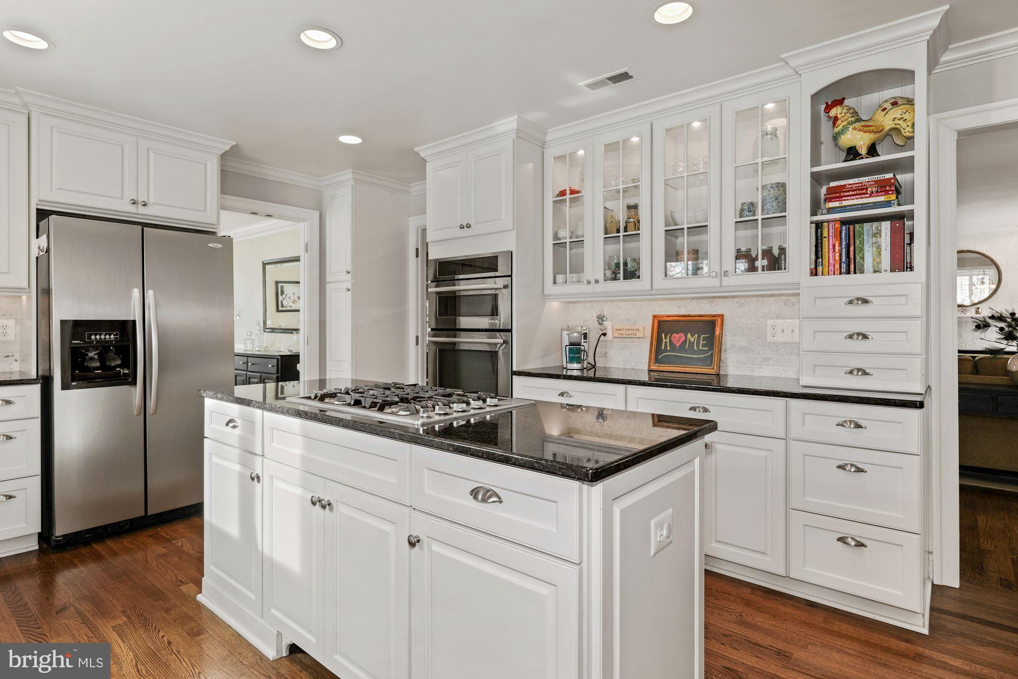 203 Tschiffely Square Road Gaithersburg, MD 20878 - Photo 13 of 38 Center island w/Jenn Air gas cooktop & granite