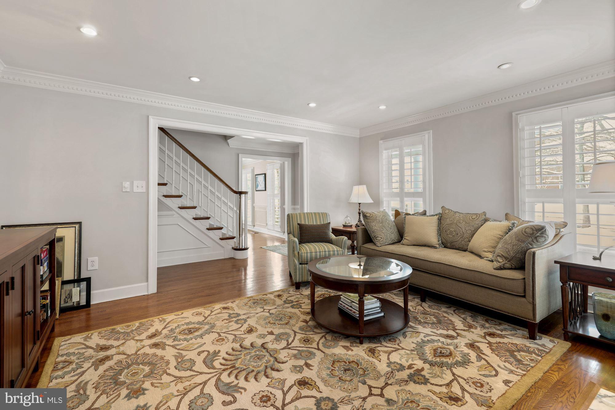 203 Tschiffely Square Road Gaithersburg, MD 20878 - Photo 5 of 38 Formal living room w/HW & plantation shutters