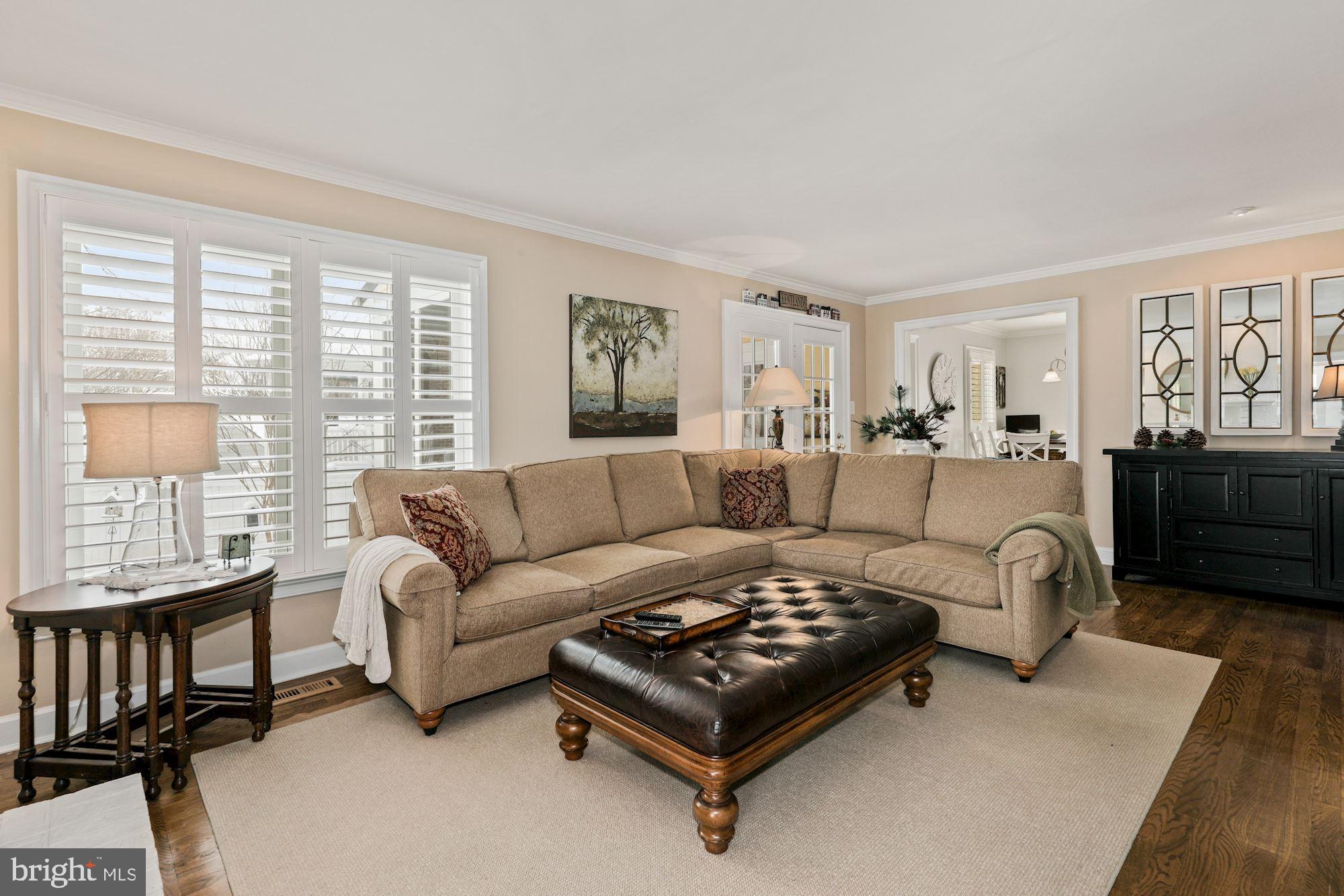 203 Tschiffely Square Road Gaithersburg, MD 20878 - Photo 8 of 38 Family room w/plantation shutters & hardwood floor