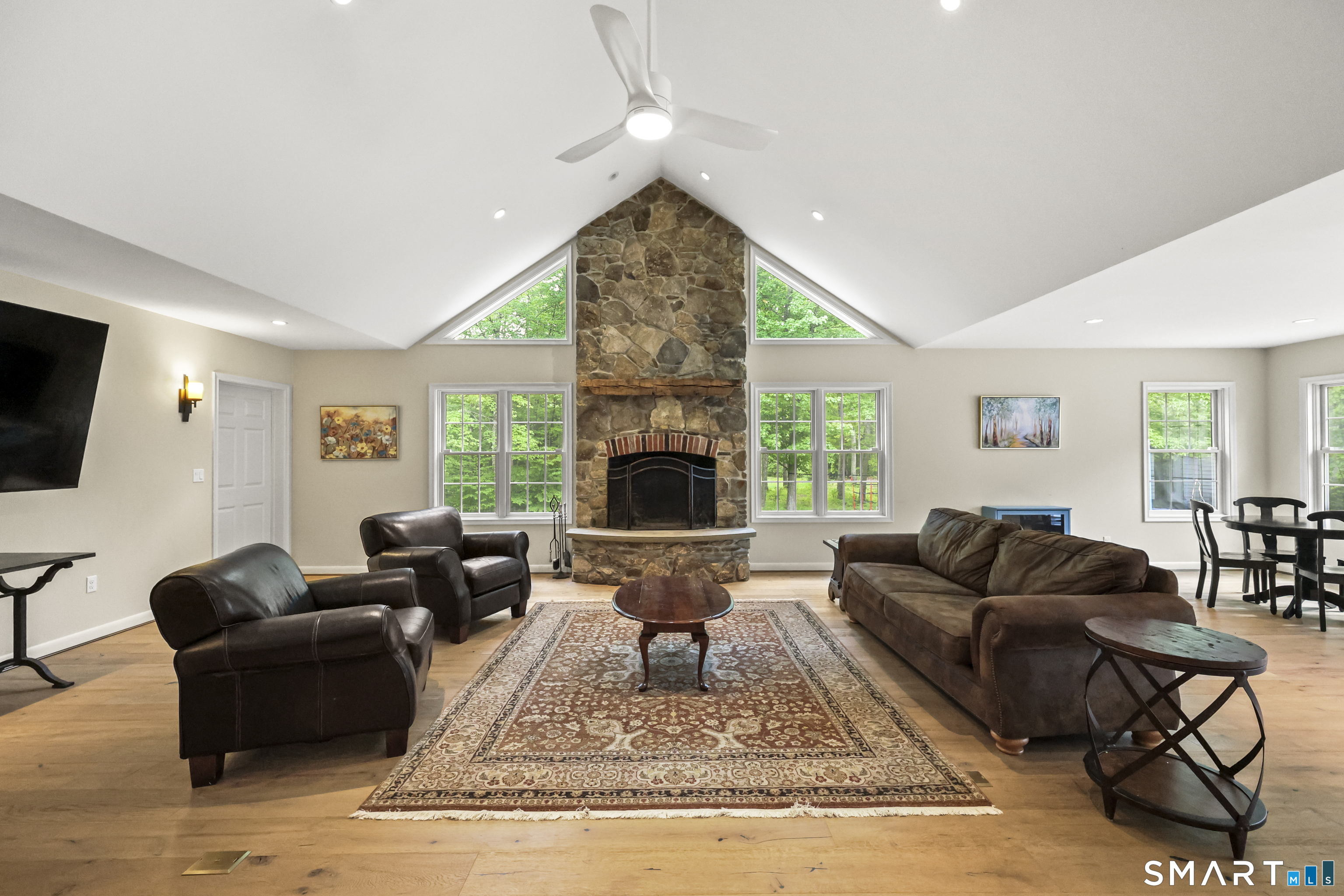 96 Spak Road Willington, CT 06279 - Photo 18 of 40 A striking floor-to-ceiling wood burning stone fireplace creates a commanding focal point.