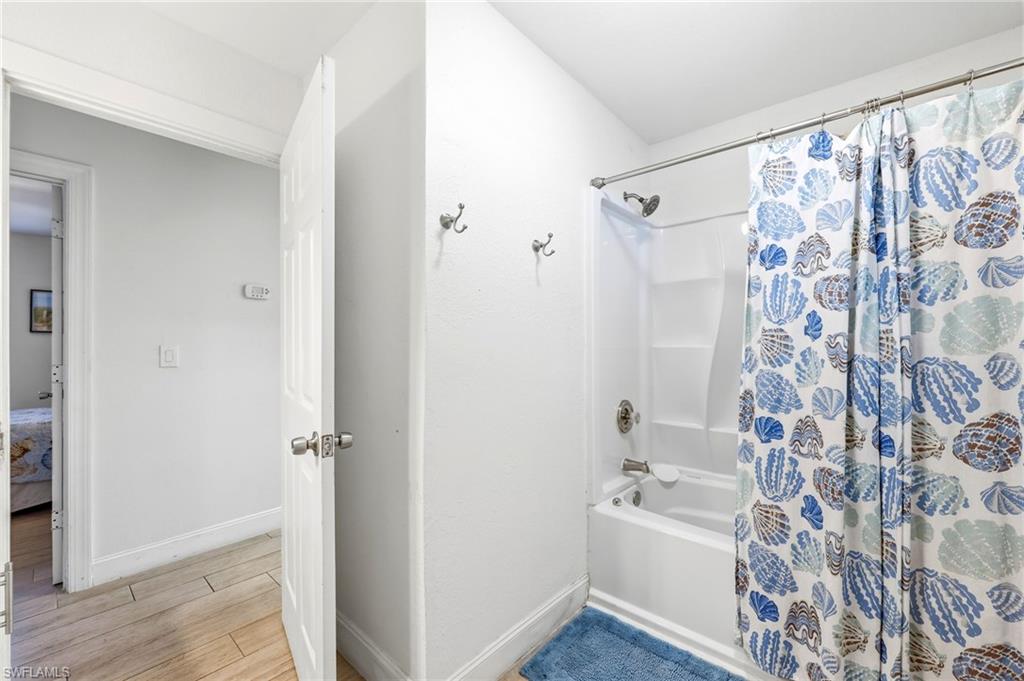 2347 Harbor Road Naples, FL 34104 - Photo 12 of 29 a bathroom with a bathtub and shower