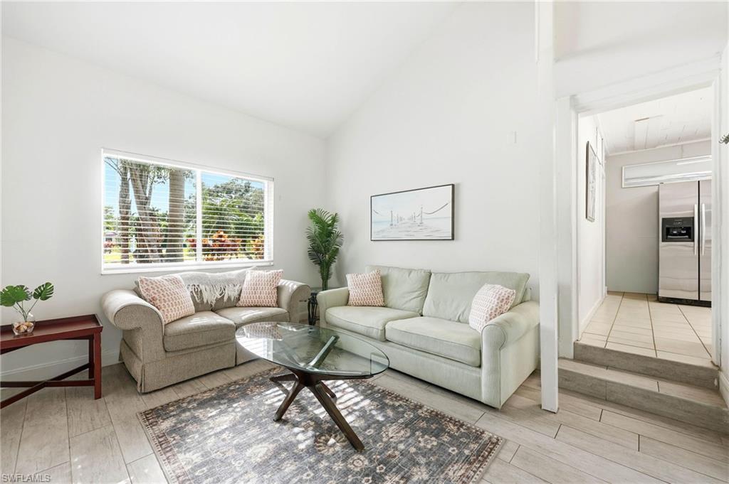 2347 Harbor Road Naples, FL 34104 - Photo 18 of 29 a living room with furniture and a window