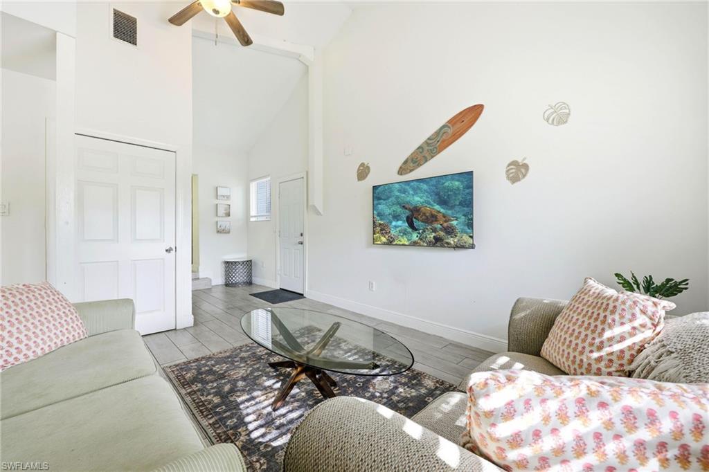 2347 Harbor Road Naples, FL 34104 - Photo 19 of 29 a living room with furniture and a rug