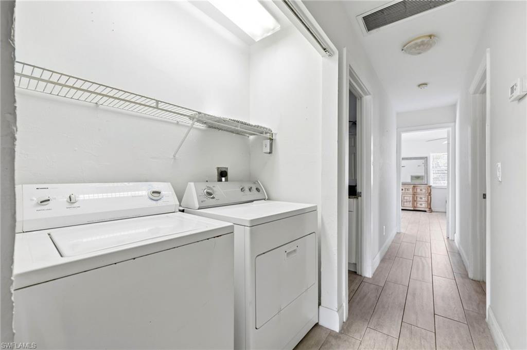 2347 Harbor Road Naples, FL 34104 - Photo 20 of 29 a view of storage and utility room with washer and dryer