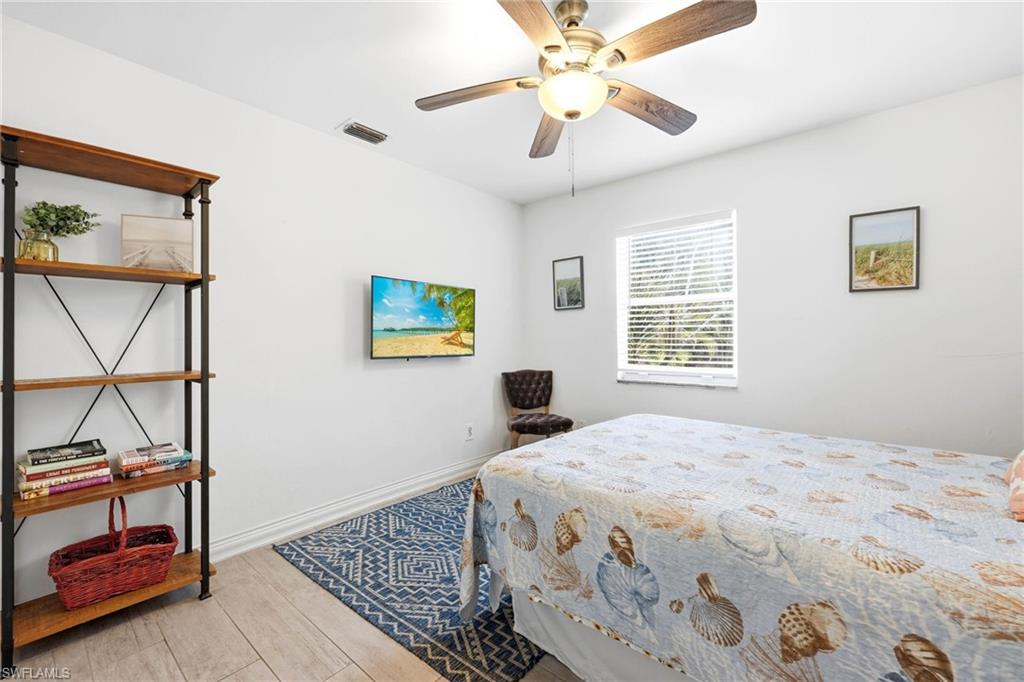 2347 Harbor Road Naples, FL 34104 - Photo 22 of 29 a bedroom with a bed and a window