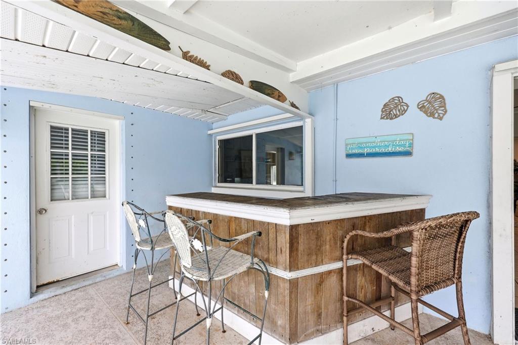 2347 Harbor Road Naples, FL 34104 - Photo 24 of 29 a view of a dining room with furniture and a window
