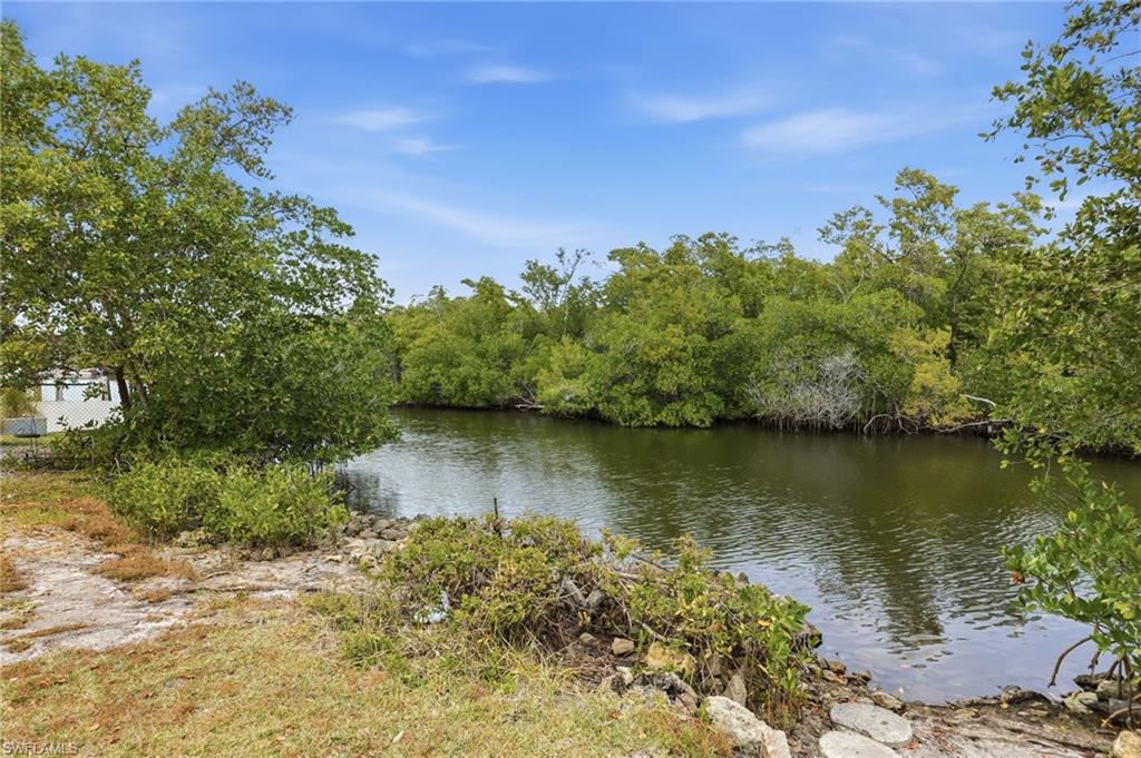 2347 Harbor Road Naples, FL 34104 - Photo 27 of 29 a view of a lake with houses in the back