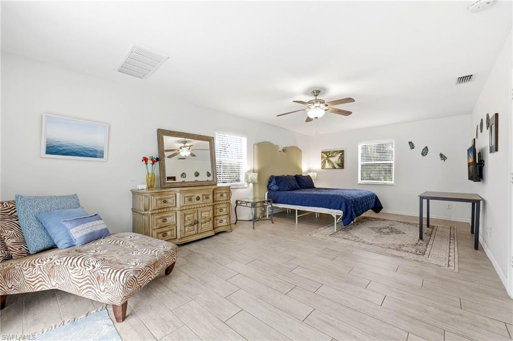 2347 Harbor Road Naples, FL 34104 - Photo 9 of 29 a living room with furniture and a table