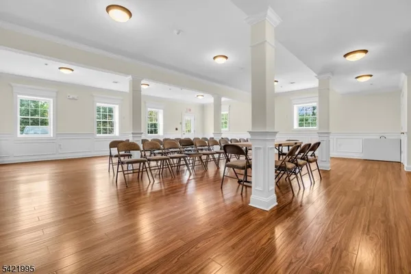 a view of dining room with furniture and wooden floor
