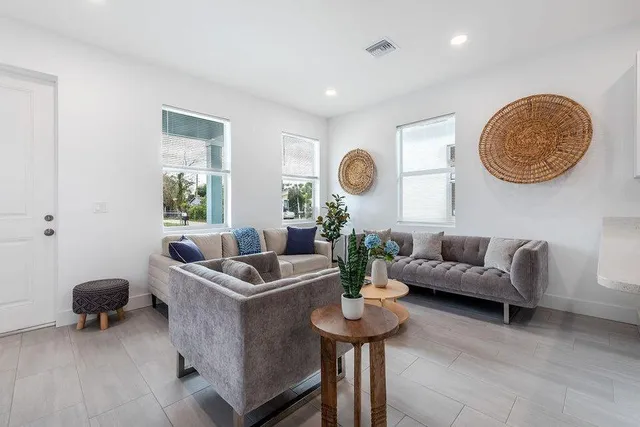 a living room with furniture and a window