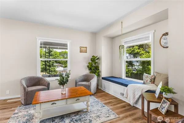 a living room with furniture and a window