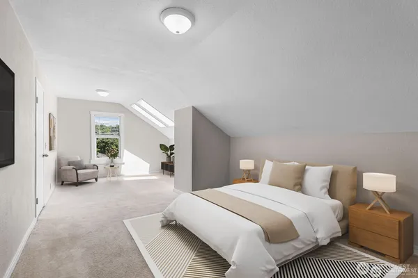 a spacious bedroom with a bed and a couch