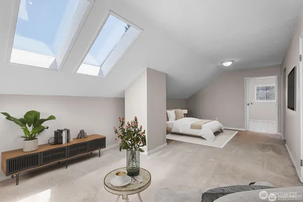 a living room with furniture and flowers