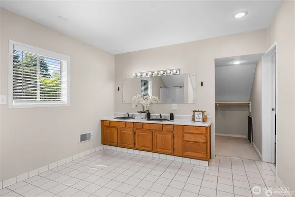a kitchen with stainless steel appliances a sink stove and cabinets
