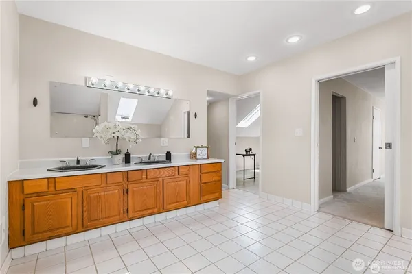 a large kitchen with a sink and cabinets