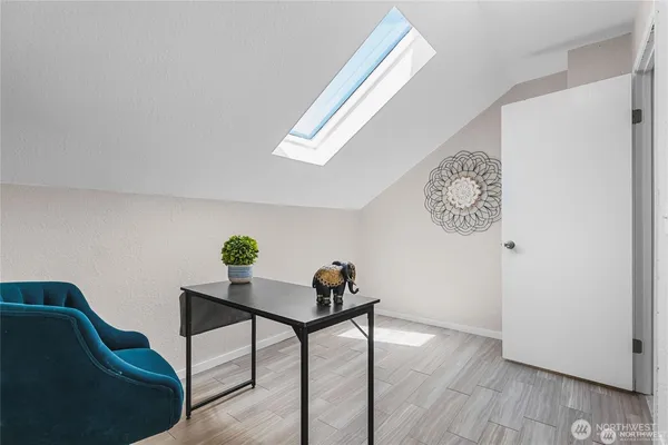 a workspace with furniture and wooden floor