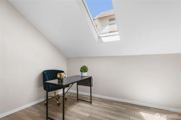 a workspace with furniture and wooden floor