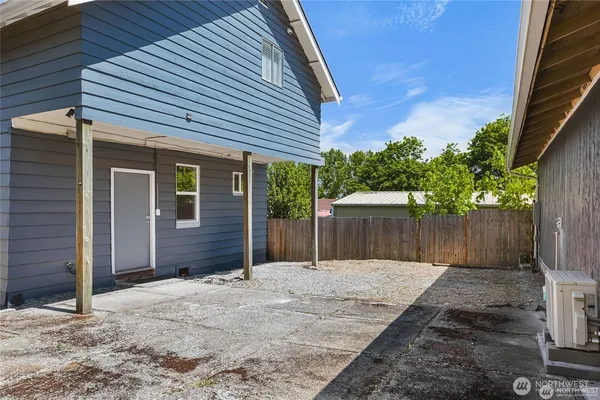 a house with a wooden fence