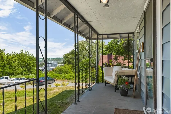 a view of porch with furniture and garden