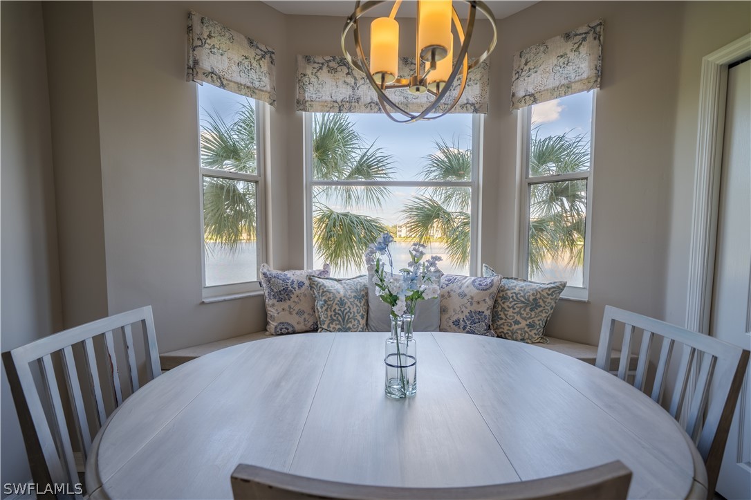 14101 Brant Point Circle, Unit 3203 Fort Myers, FL 33919 - Photo 1 of 34 a view of a dining room with furniture window and outside view