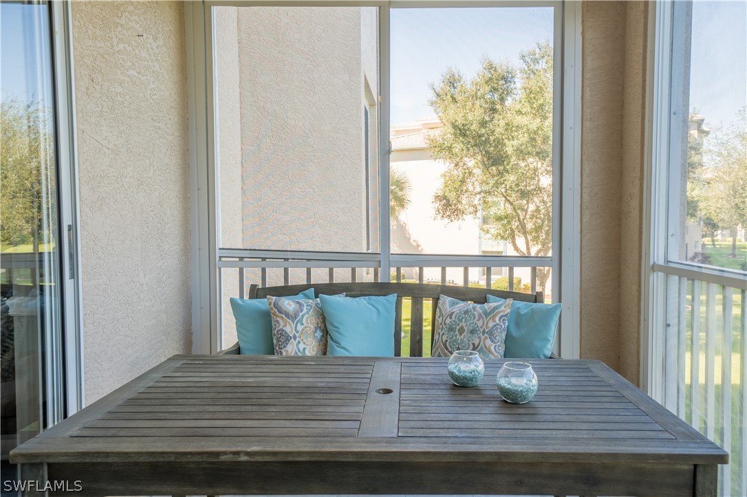 14101 Brant Point Circle, Unit 3203 Fort Myers, FL 33919 - Photo 14 of 34 a view of wooden floor and a dining room